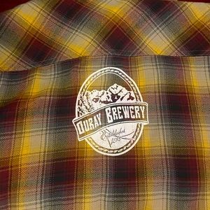 Outdoor Research heavy flannel size L with Ouray Brewery logo on back.